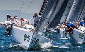 Santa Barbara resident John Demourkas at the helm of Groovederci (bow #9) jockeys for position  on the starting line at the 2014 Rolex Farr 40 North American Championship  (credit: Rolex/Daniel Forster)